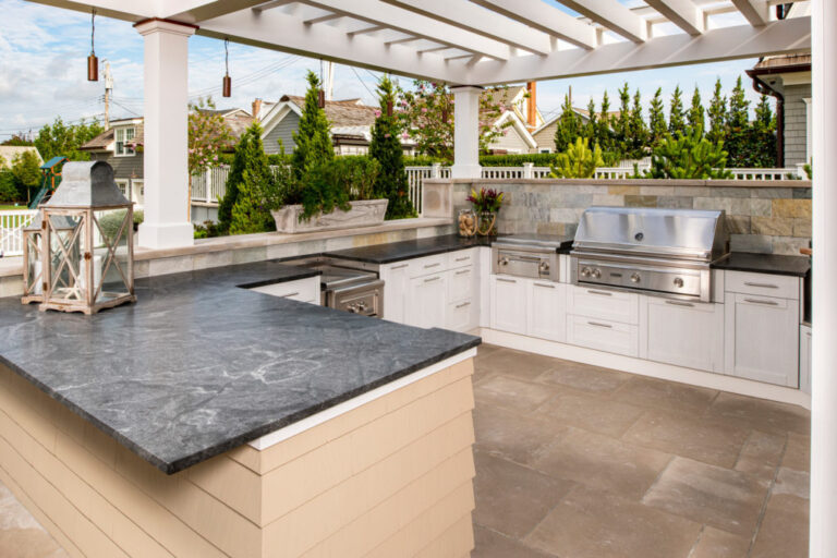 Premium granite countertops in a stylish outdoor kitchen setup in a Frisco backyard