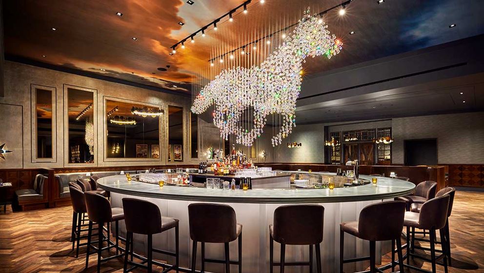 Luxury onyx surfaces enhancing hotel and restaurant interiors in Frisco, TX with elegance and durability.