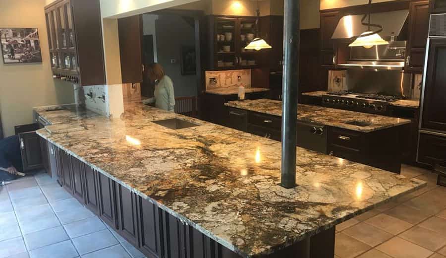 Close-up view of marble and granite countertops side by side in a Frisco Texas kitchen