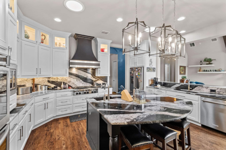 Modern kitchen after countertop remodelling in Frisco Texas featuring seamless quartz surfaces and professional installation