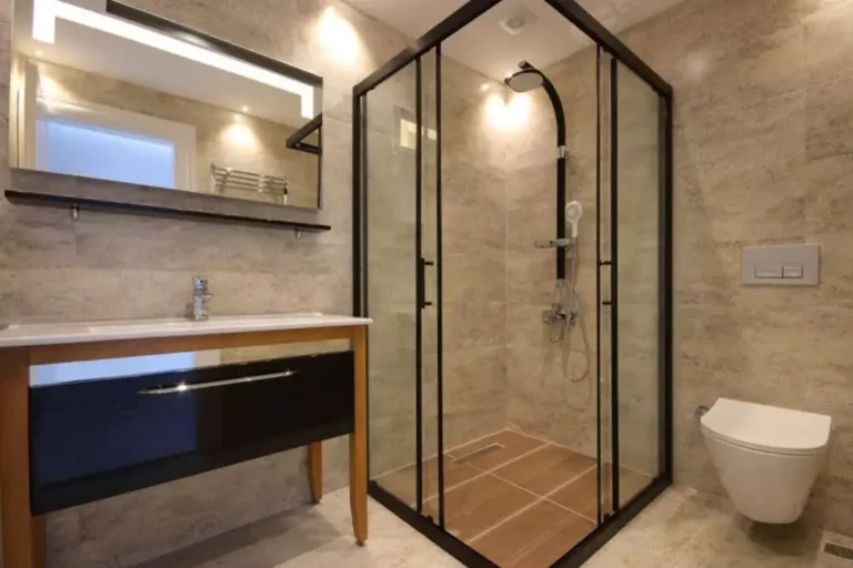 Walk-in and frameless shower comparison in a modern Frisco Texas bathroom showcasing glass enclosure and tile design